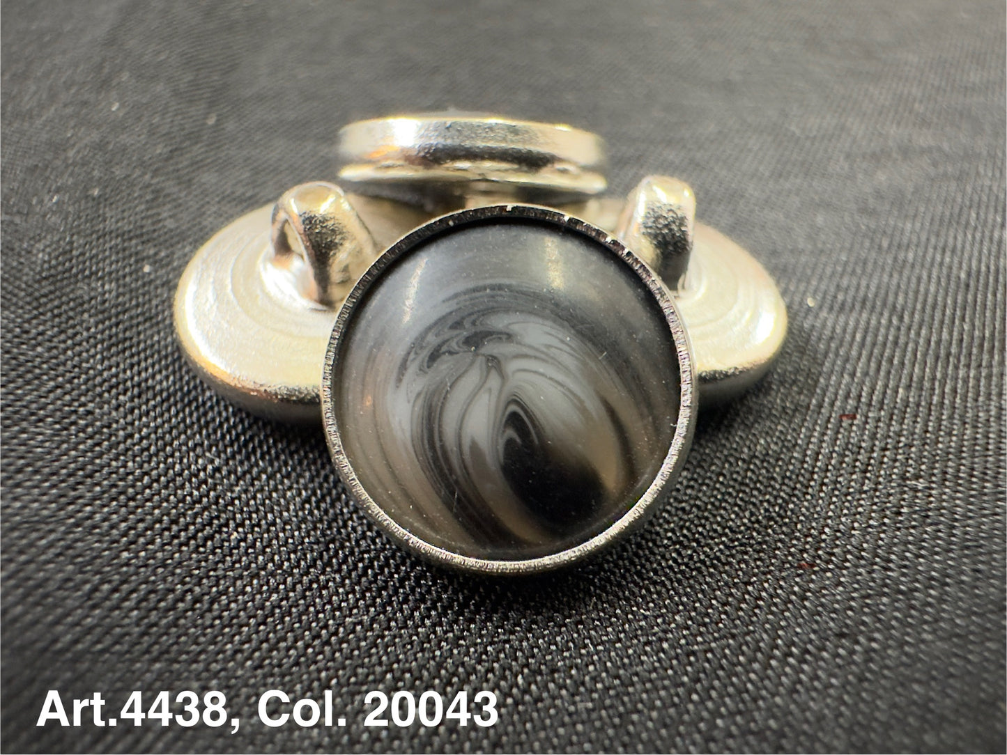 Buttonology Inc metal shank button with marbled gray dome on black fabric polyester garment shank for coats and jackets