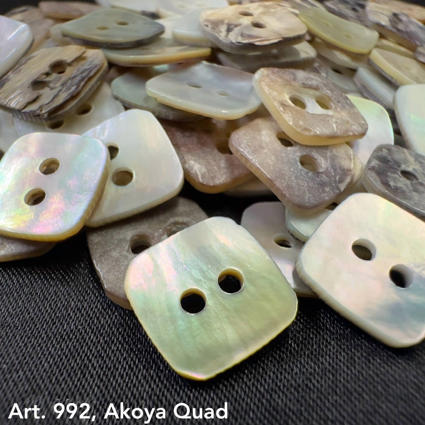 Assorted natural shell buttons in Akoya Quad button design by Buttonology Inc