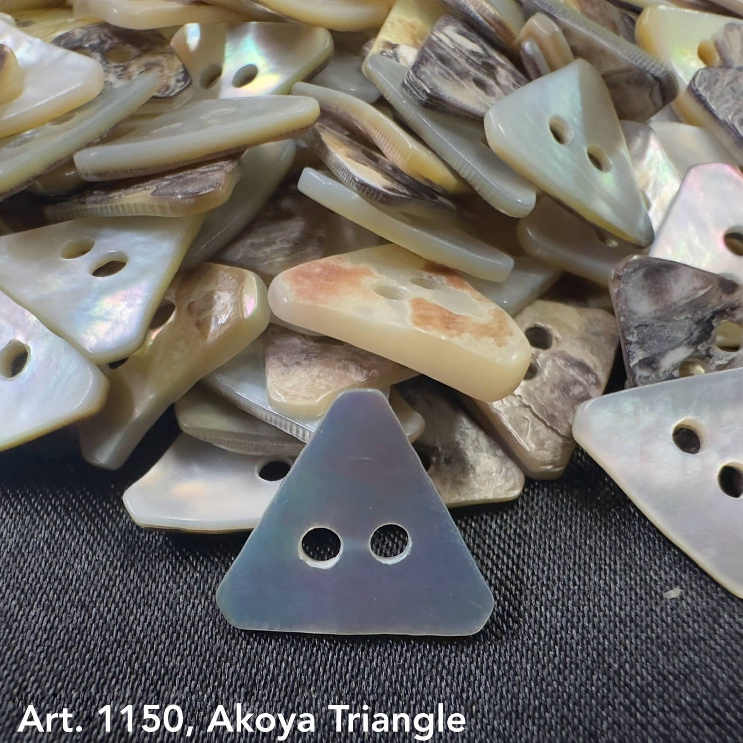 Akoya triangle buttons by Buttonology Inc made of iridescent shell material with two holes for sewing