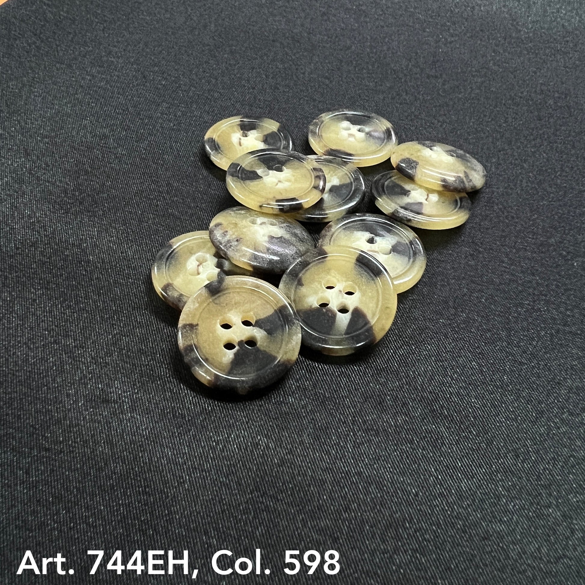 Buttonology Inc fort horn effect four hole buttons beige and black marbled sew through buttons on black fabric