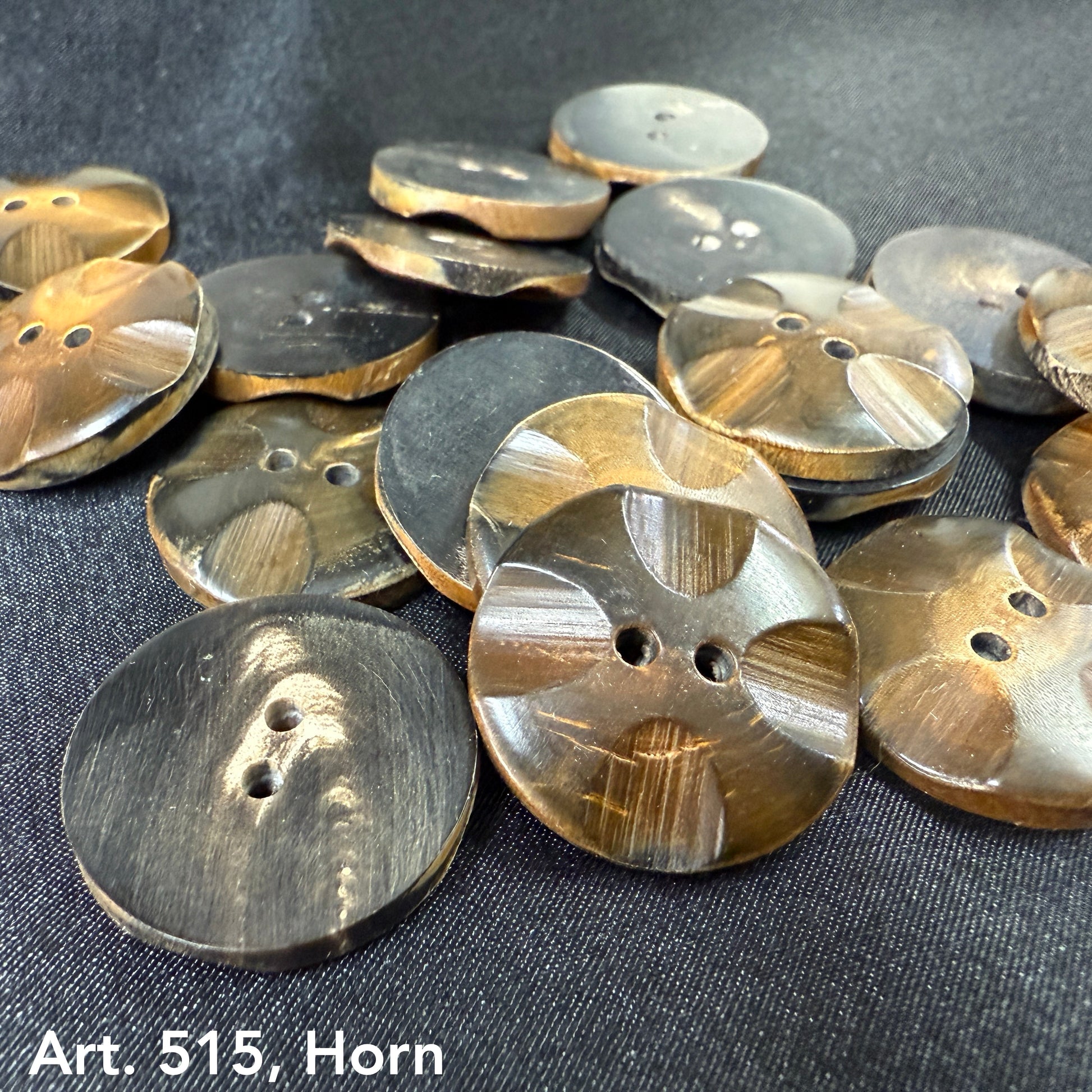 Artisan horn buttons for crafts in various shades of brown and black from Buttonology Inc