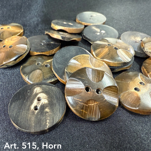 Artisan horn buttons for crafts in various shades of brown and black from Buttonology Inc