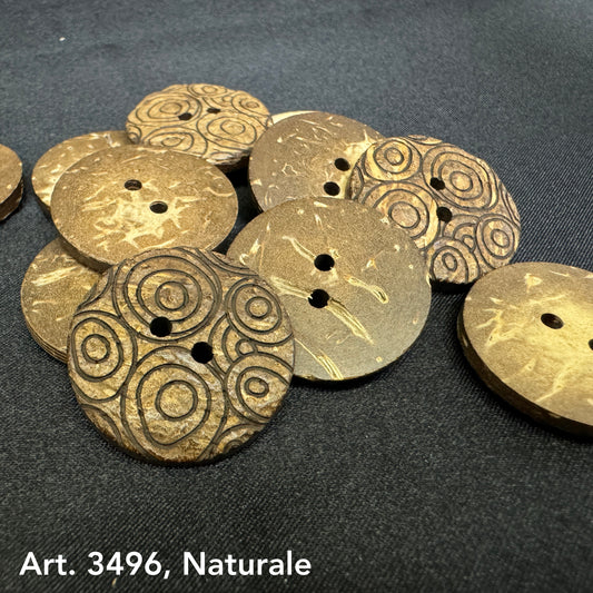 Sustainable coconut buttons with natural wood texture and circular engraved patterns by Buttonology Inc