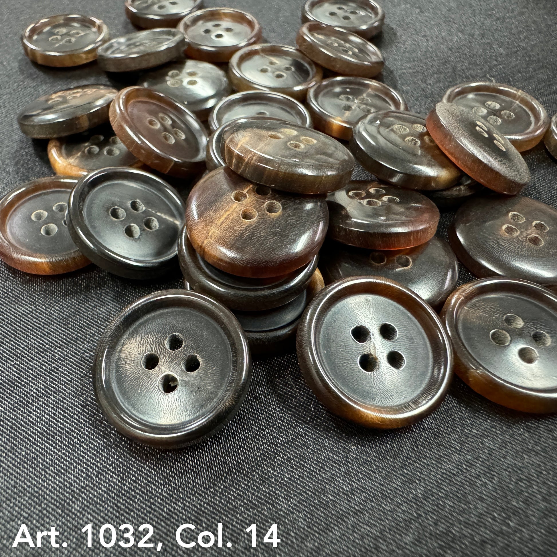 Sustainable real horn buttons by Buttonology Inc in dark brown shades with four holes on black fabric