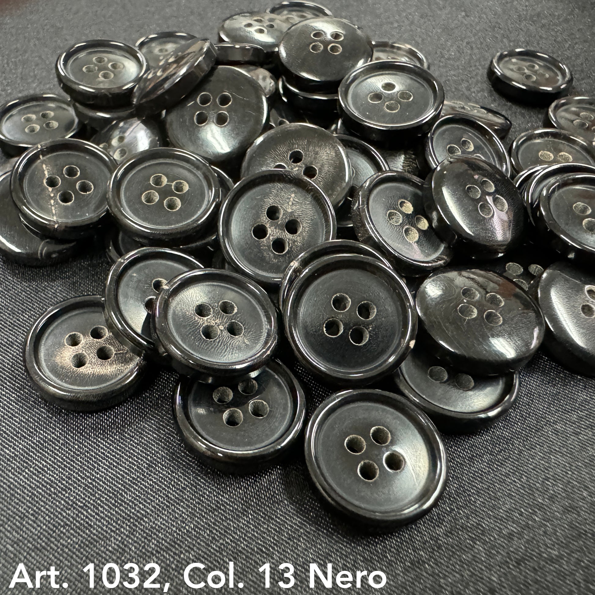 Sustainable real horn buttons by Buttonology Inc in glossy black with four holes for sewing