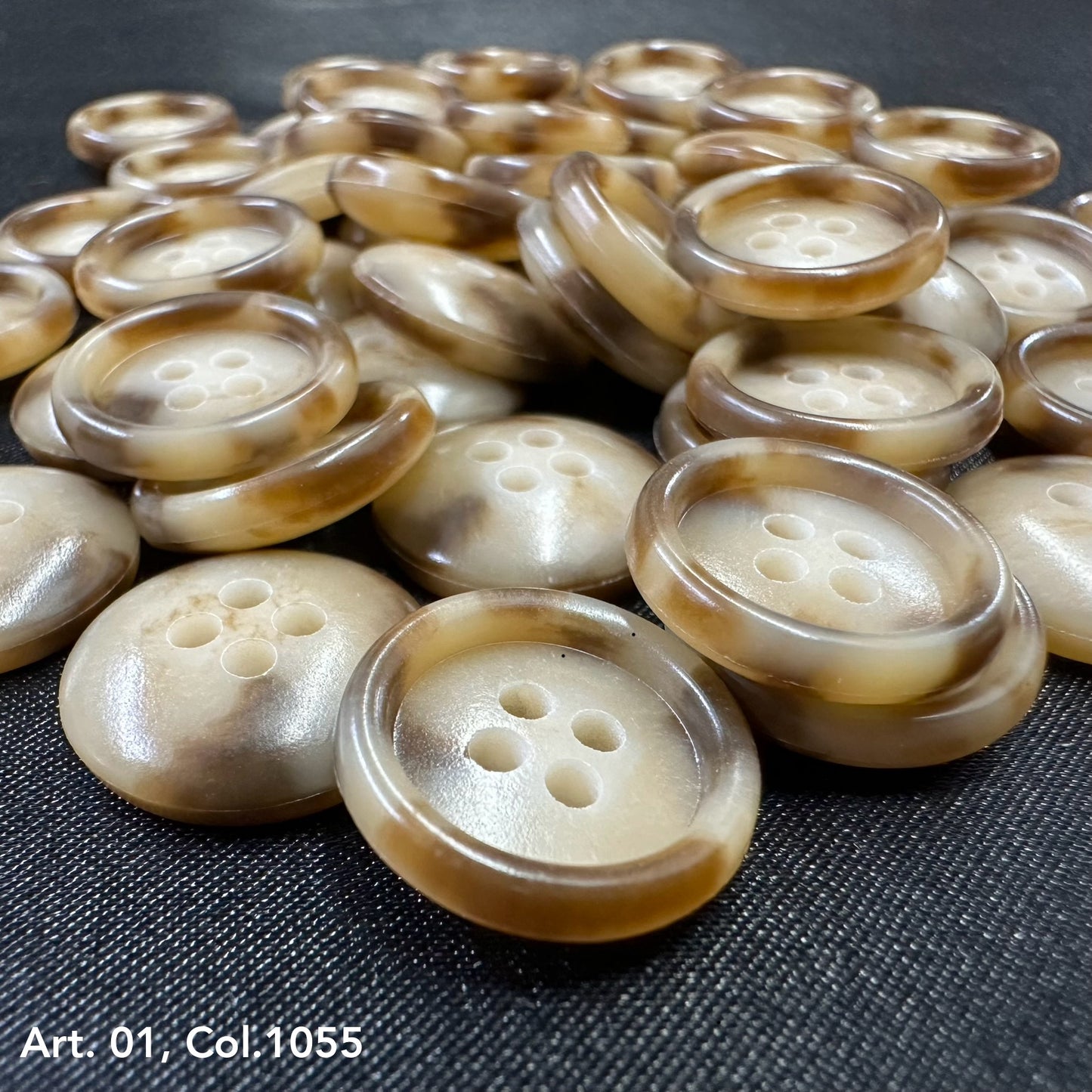 Buttonology Inc brown marbled four hole round buttons on black fabric premium shirt buttons for sewing