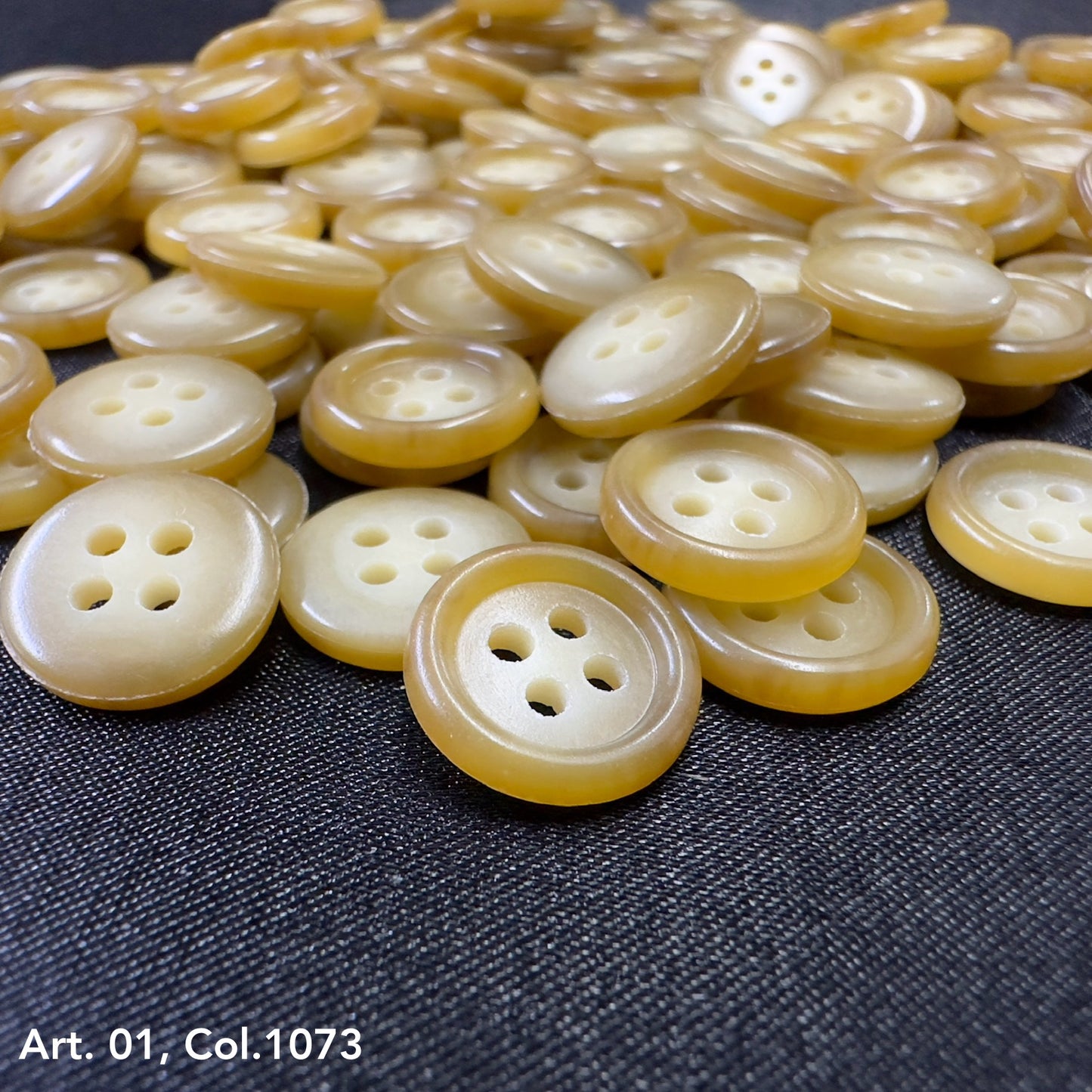 Buttonology Inc premium shirt buttons for sewing glossy cream yellow 4 hole round buttons on dark fabric