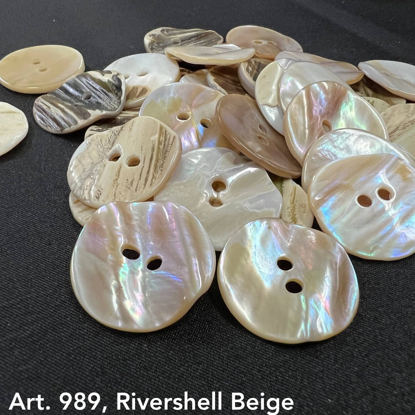 Beige rivershell buttons by Buttonology Inc in various shapes and natural shiny textures