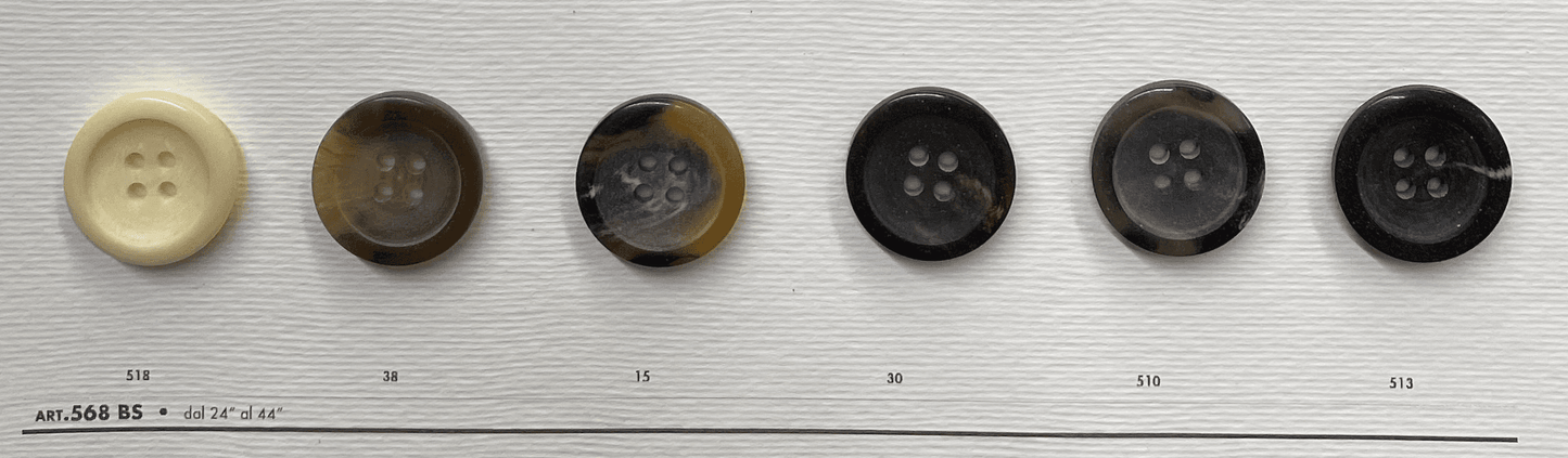 Variety of black 4-hole garment buttons displayed on a white background for sewing projects