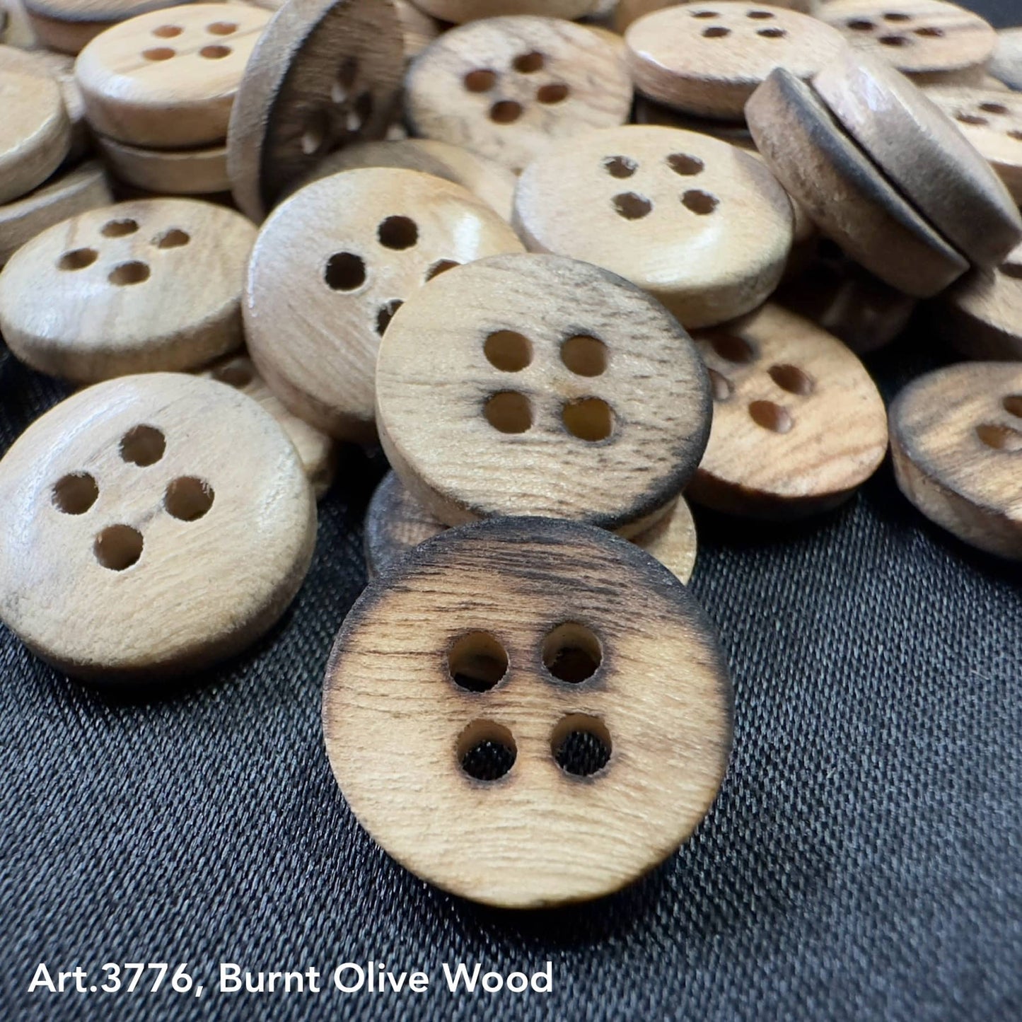 Assorted burnt olivewood buttons with four holes, perfect for crafts and garment repair