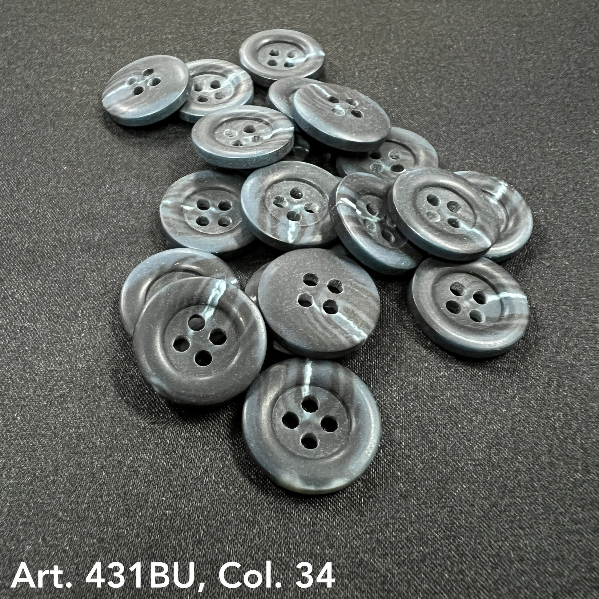 Gray marbled round buttons for sale with four holes by Buttonology Inc on black fabric