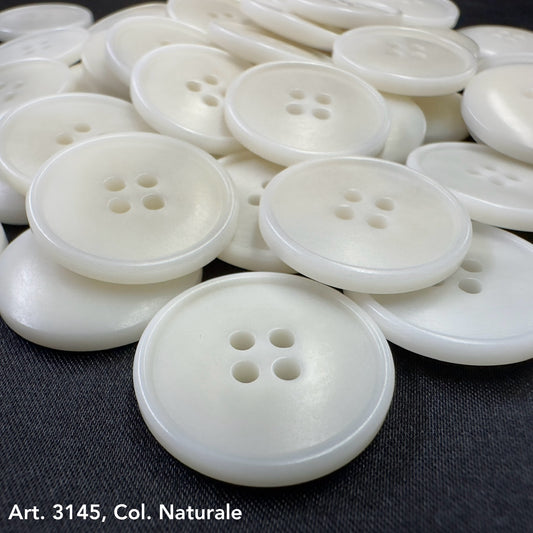 White corozo buttons with four holes by Buttonology Inc to buy corozo buttons online