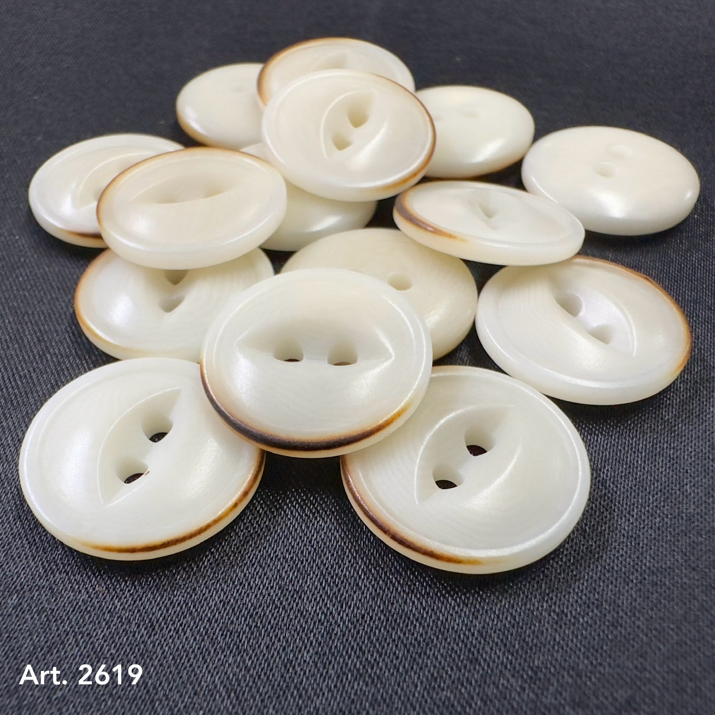 Buy eco-friendly burnt corozo buttons online with natural cream color and brown edges from Buttonology Inc