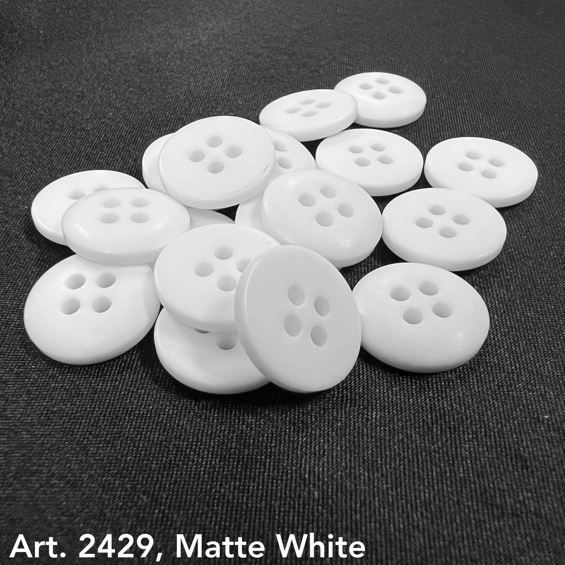 Matte white sewing buttons with four holes by Buttonology Inc to buy sewing buttons online