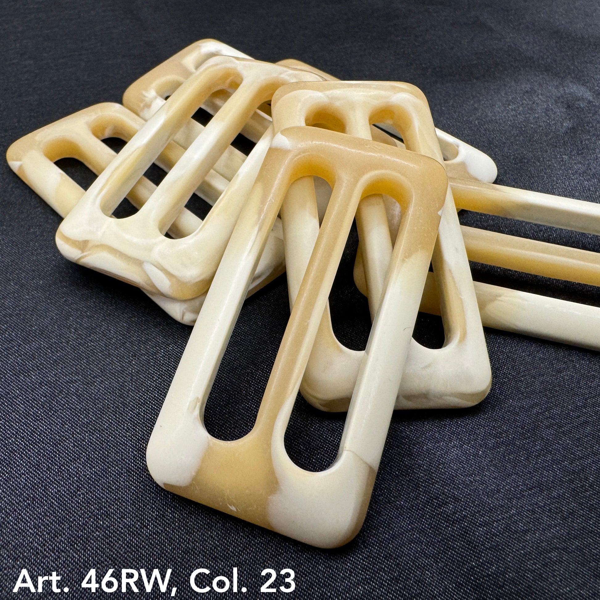 Buttonology Inc decorative belt buckle buttons in beige and cream tones with rectangular cutouts