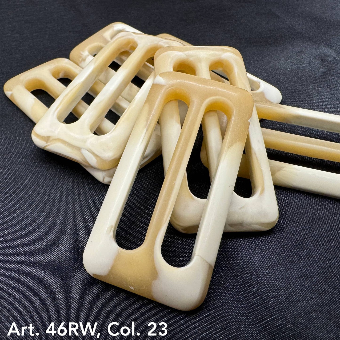 Buttonology Inc decorative belt buckle buttons in beige and cream tones with rectangular cutouts