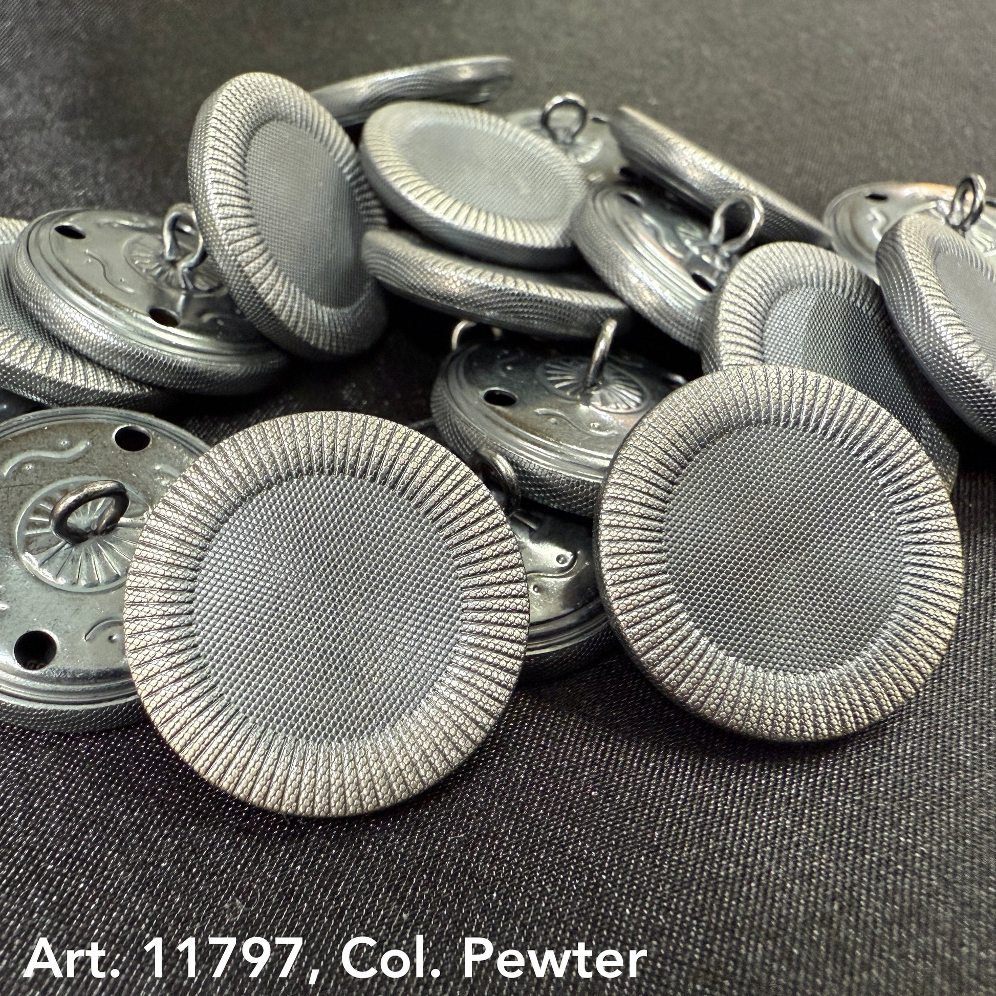 Decorative sewing buttons for coats in pewter color with textured rim by Buttonology Inc.