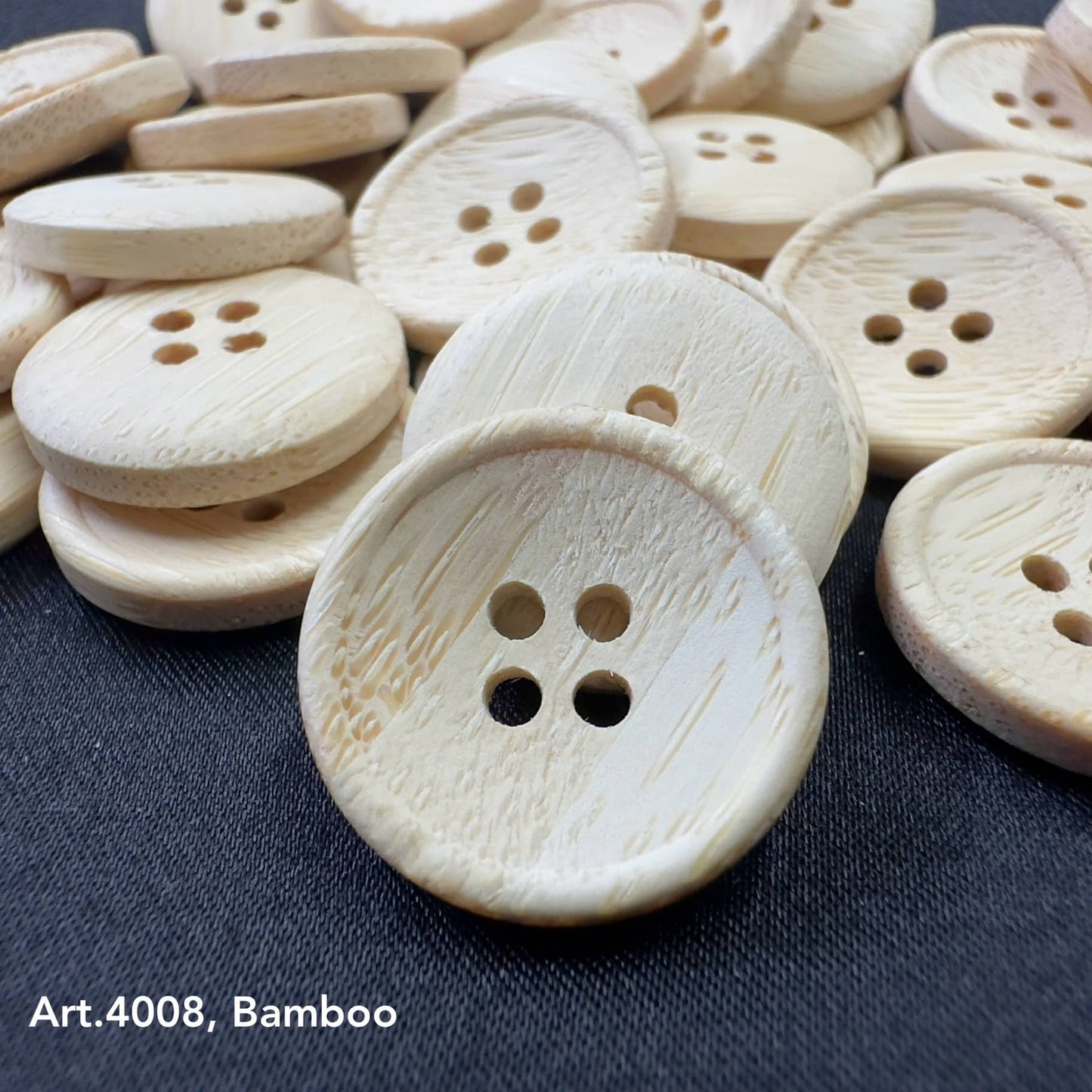 Eco-friendly bamboo buttons by Buttonology Inc with natural wood texture and four holes