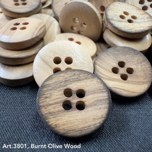 Eco-Friendly burnt olivewood buttons by Buttonology Inc with natural wood grain and four holes