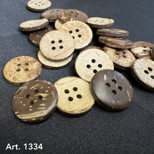 Eco-friendly coconut buttons by Buttonology Inc in natural brown and beige tones with four holes each