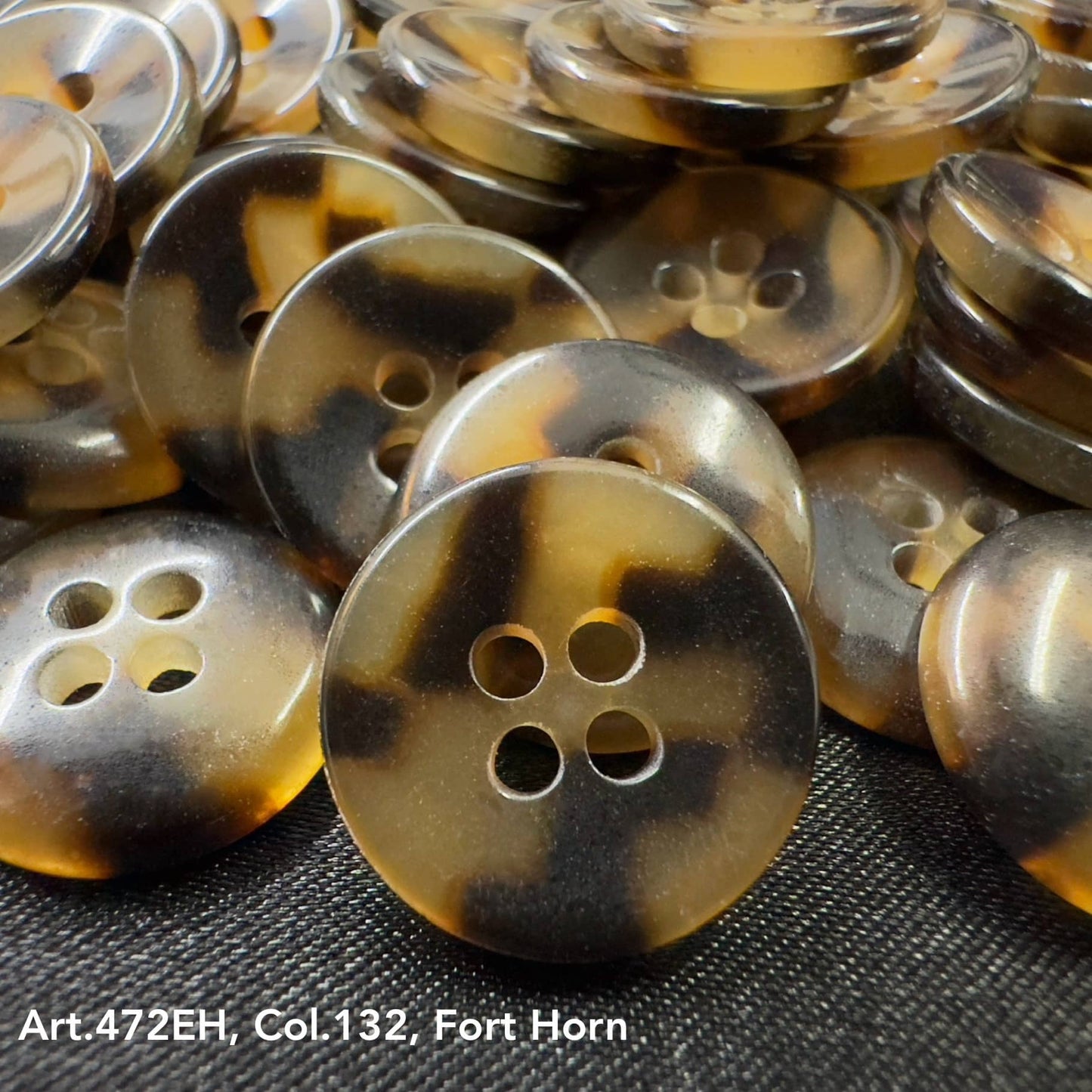 Close-up of fort horn garment buttons by Buttonology Inc with a marbled brown and black pattern