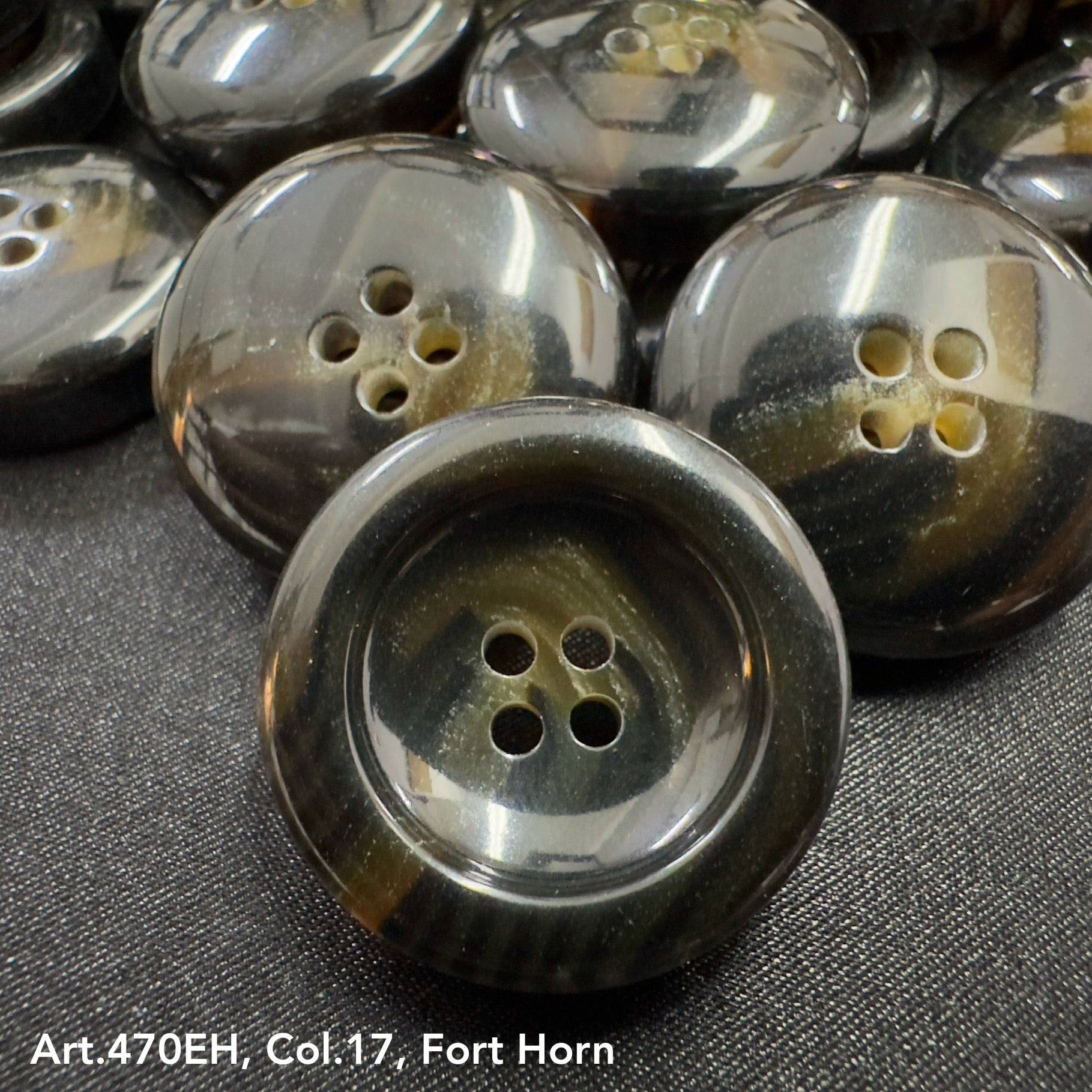 High-quality garment buttons in Fort Horn color with four holes for easy sewing and styling