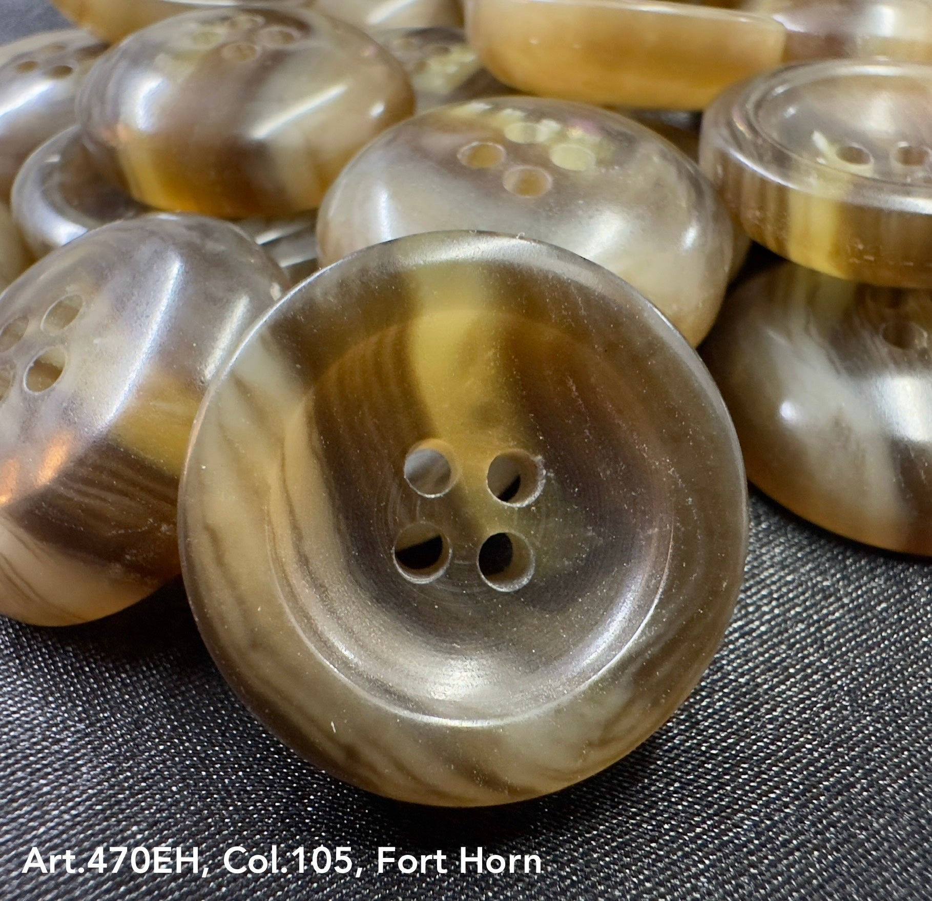 High-quality garment buttons in Fort Horn color with a glossy finish and four holes for easy sewing