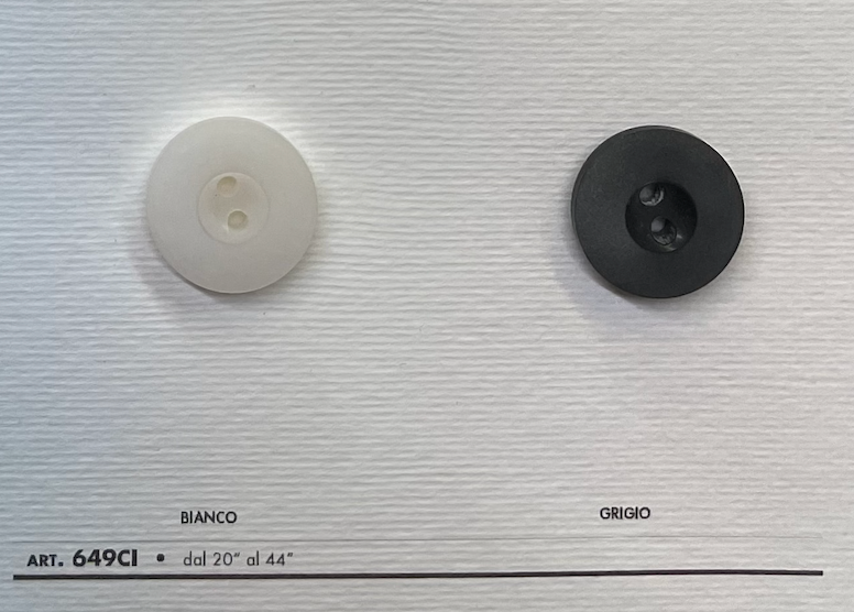 High-quality sewing buttons in white and black from Buttonology Inc for versatile garment use