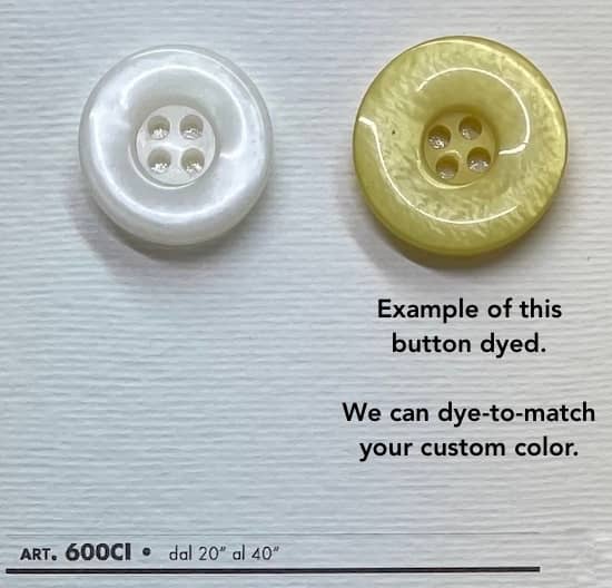 High-quality white buttons by Buttonology Inc next to a dyed yellow button example