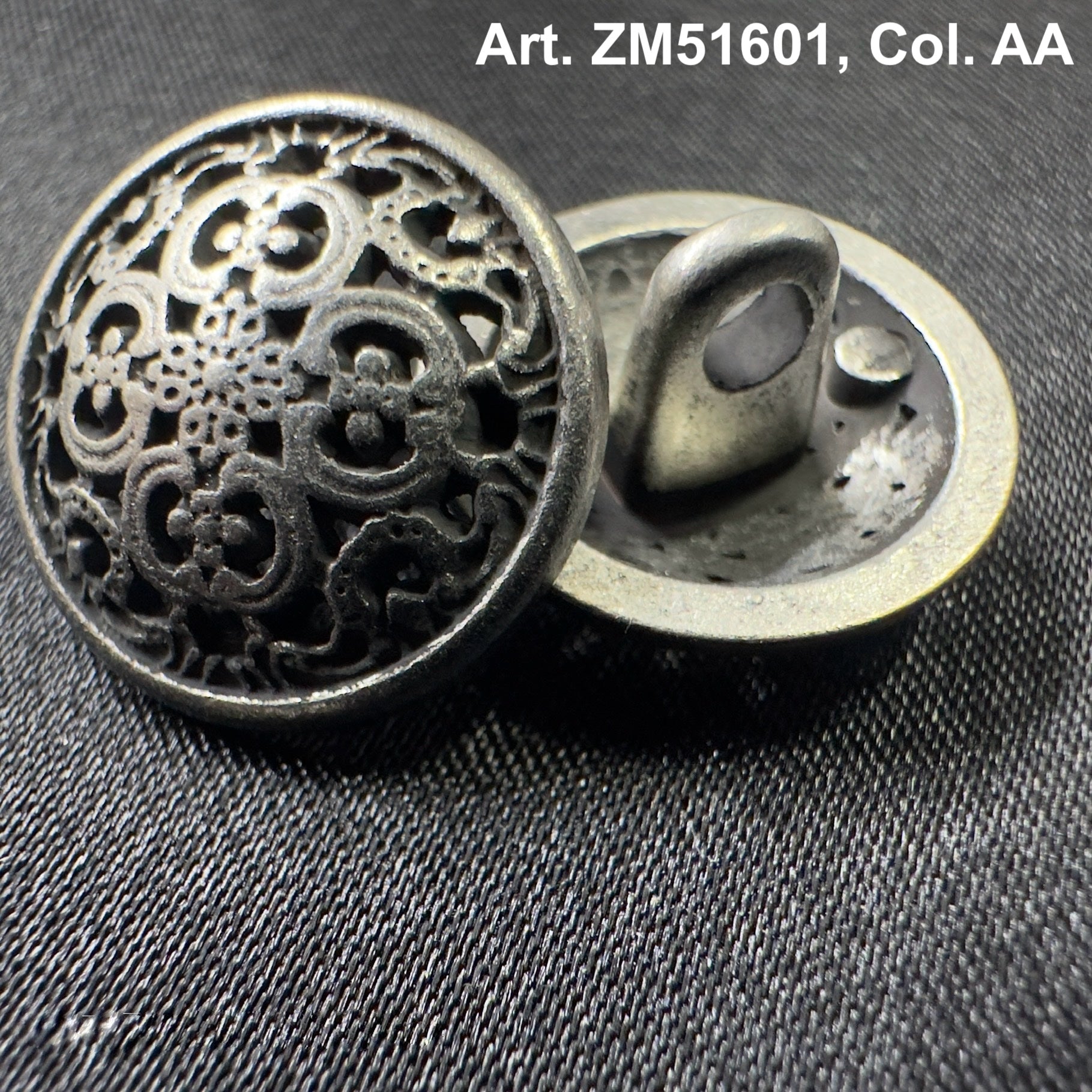 Metal decorative sewing shank buttons with intricate floral cutout design from Buttonology Inc