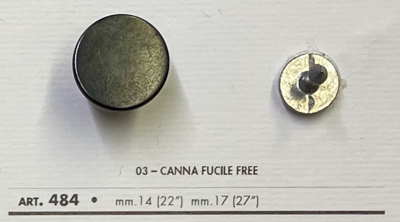 Metal jeans button for sewing in black, featuring a smooth surface and attached prong