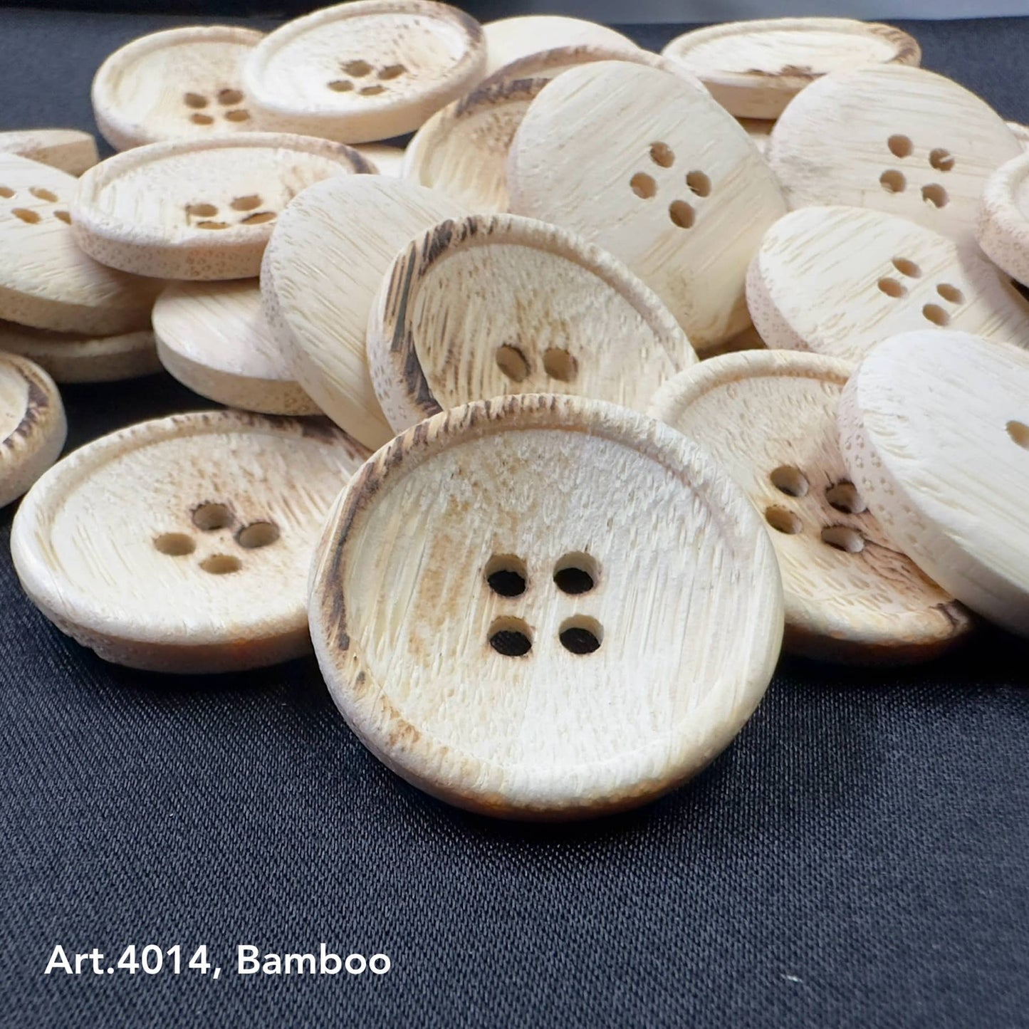 Burnt bamboo buttons with four holes in natural wood finish from Buttonology Inc