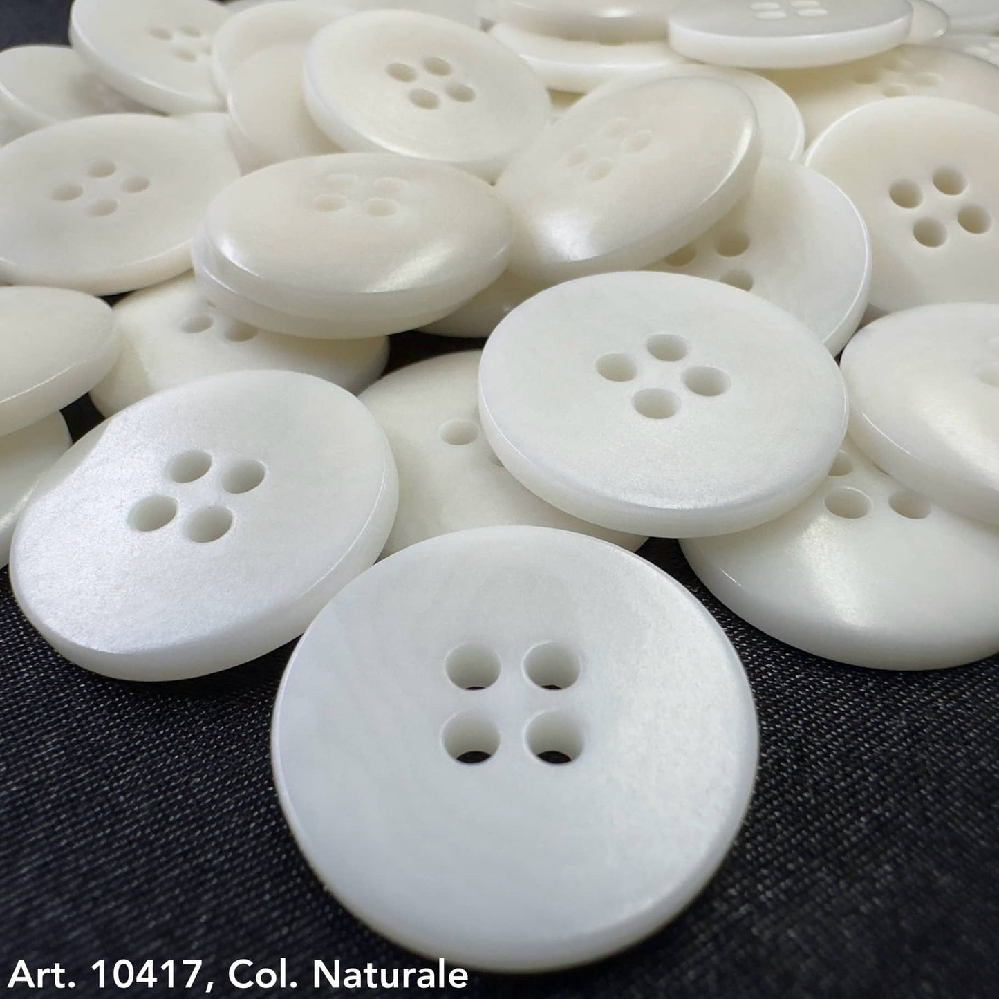 White round buttons from Buttonology Inc, an example of sustainable clothing accessories for eco-friendly fashion