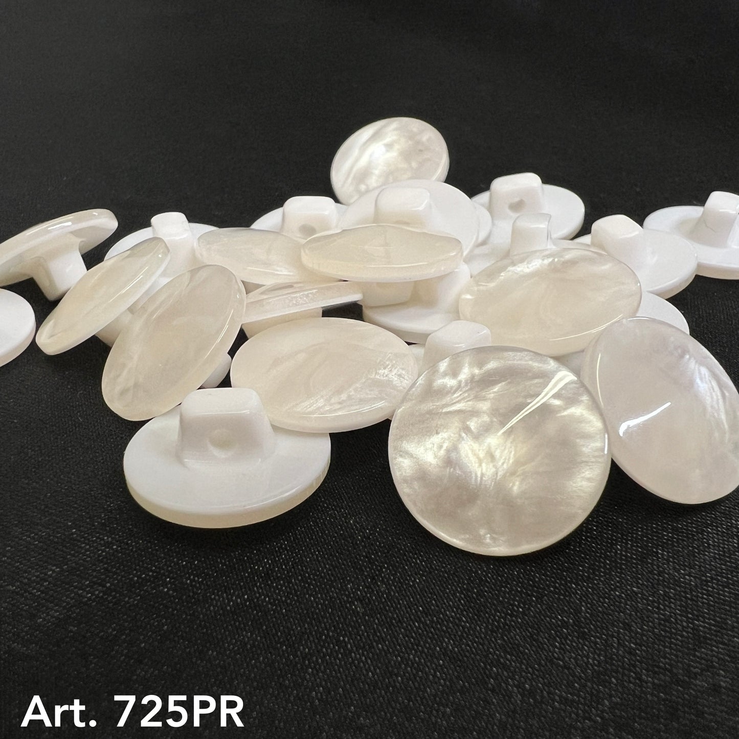 Collection of pearl shank buttons with a glossy finish for sewing and crafting projects
