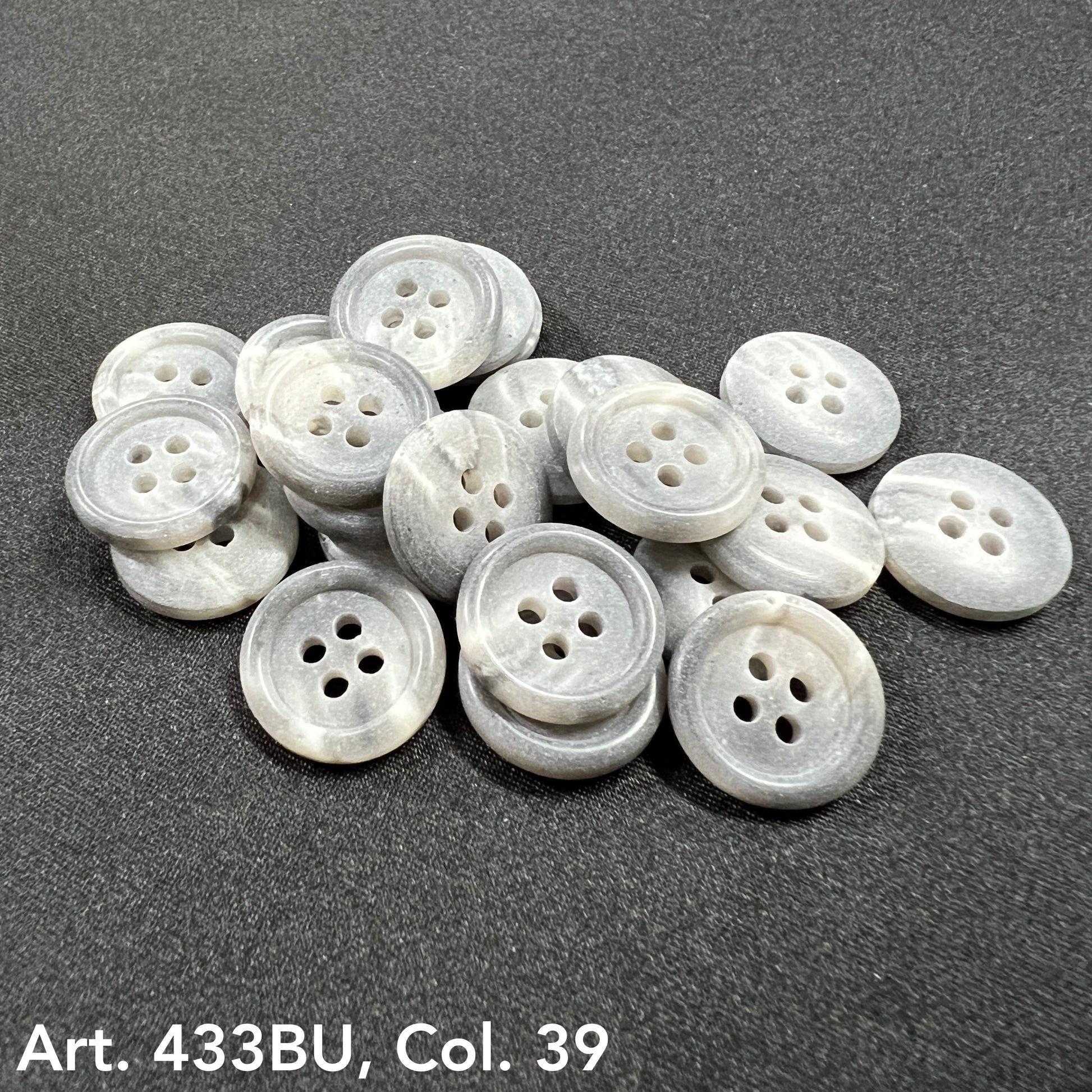 Premium 4-hole sewing buttons in a light gray color, perfect for garments and crafts