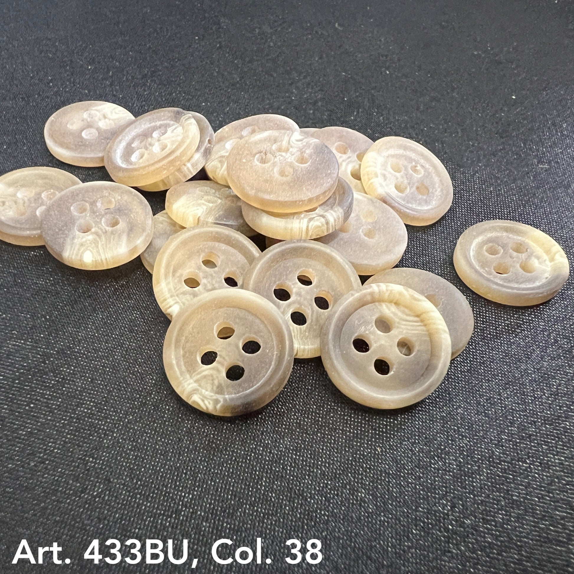 Premium 4-hole sewing buttons in a light beige color, perfect for crafts and clothing projects