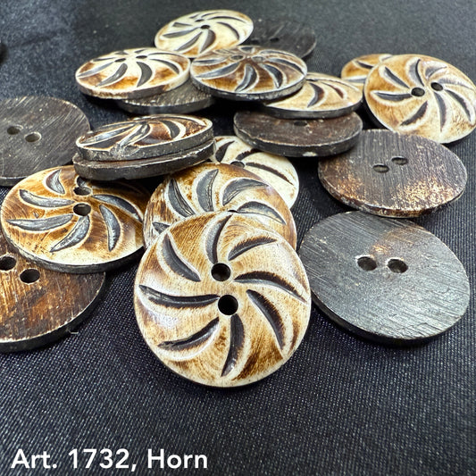 Premium carved horn button by Buttonology Inc with intricate swirl design and two holes