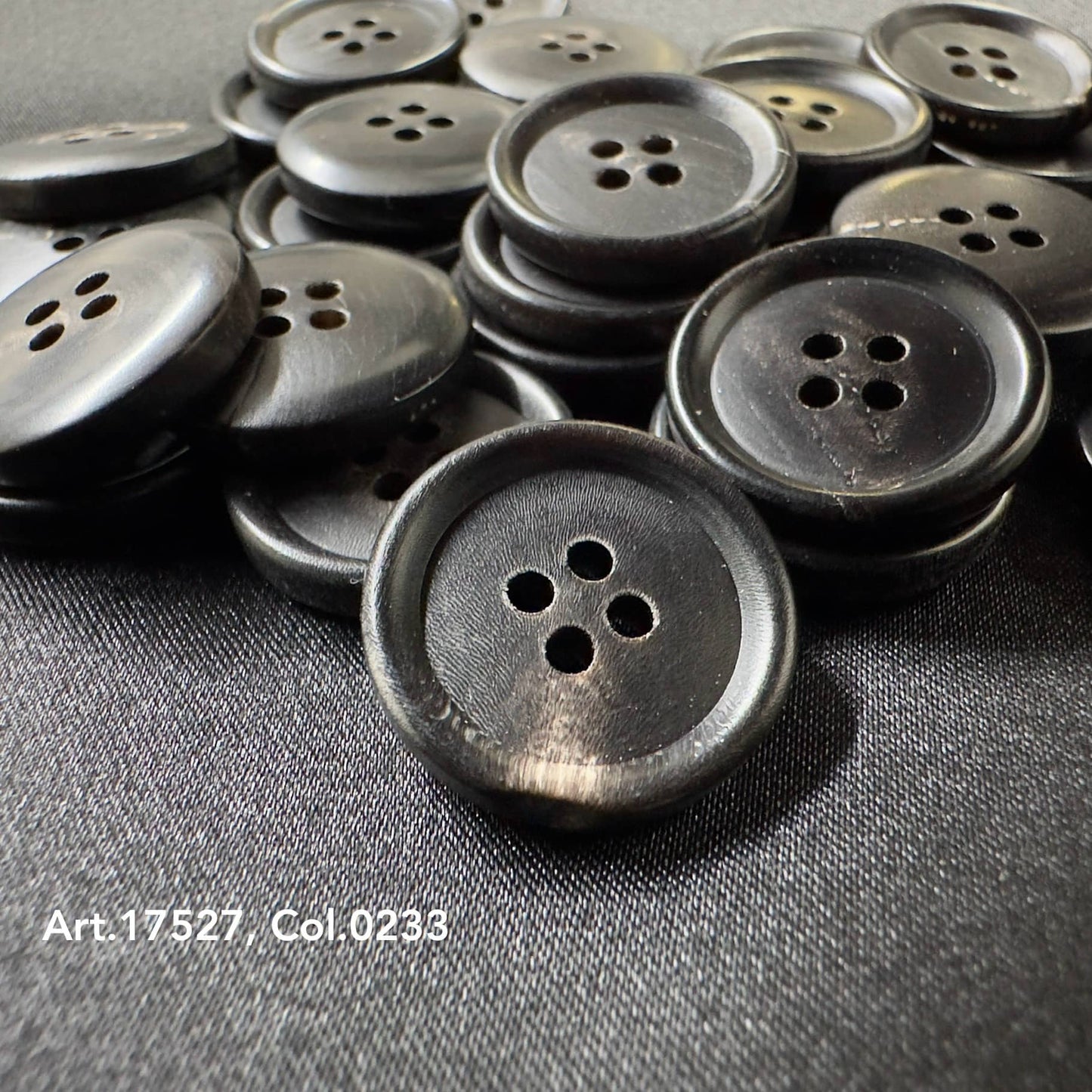 Premium horn sewing button by Buttonology Inc made of dark polished horn with four holes for sewing