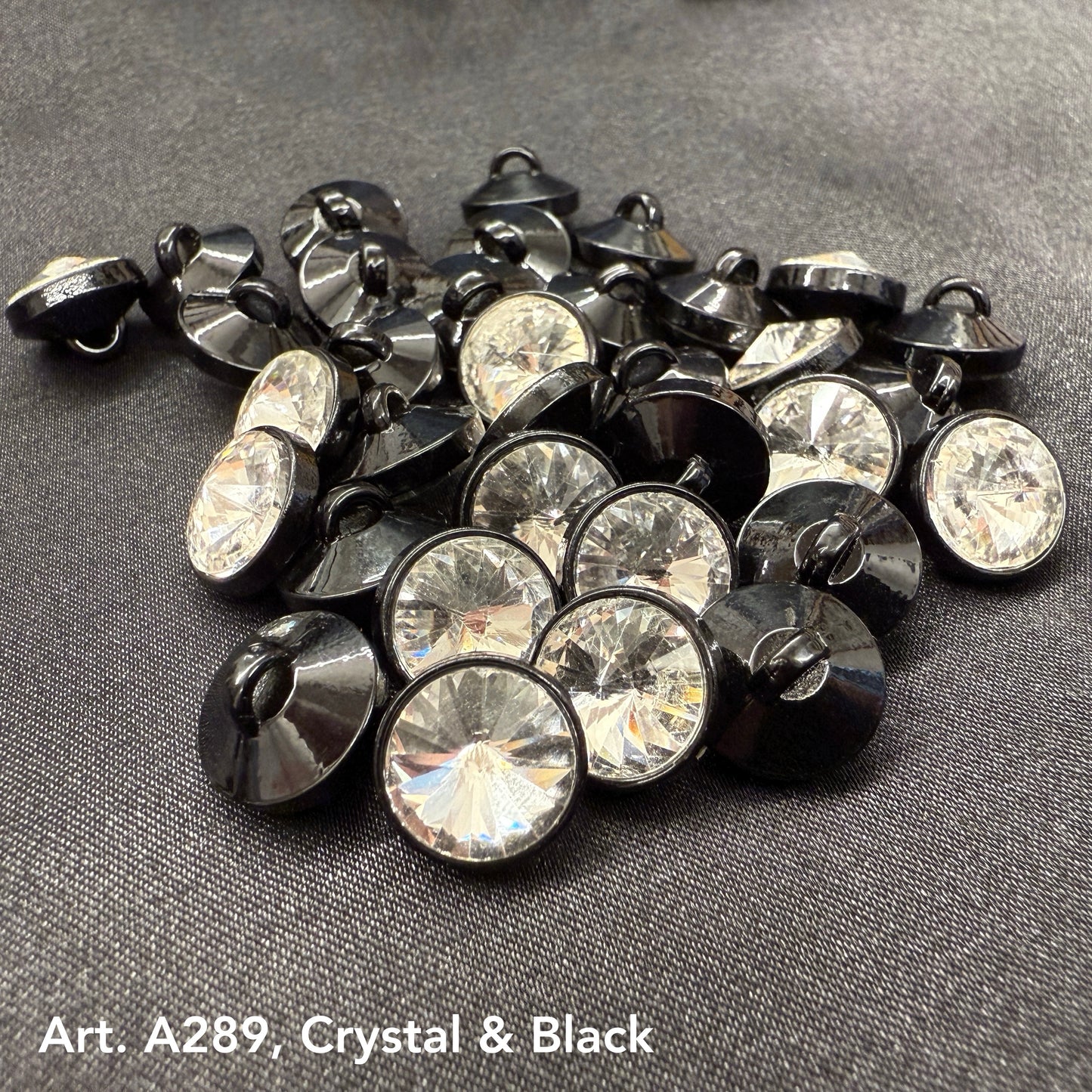 Assorted premium rhinestone buttons for dresses in crystal and black finish by Buttonology Inc