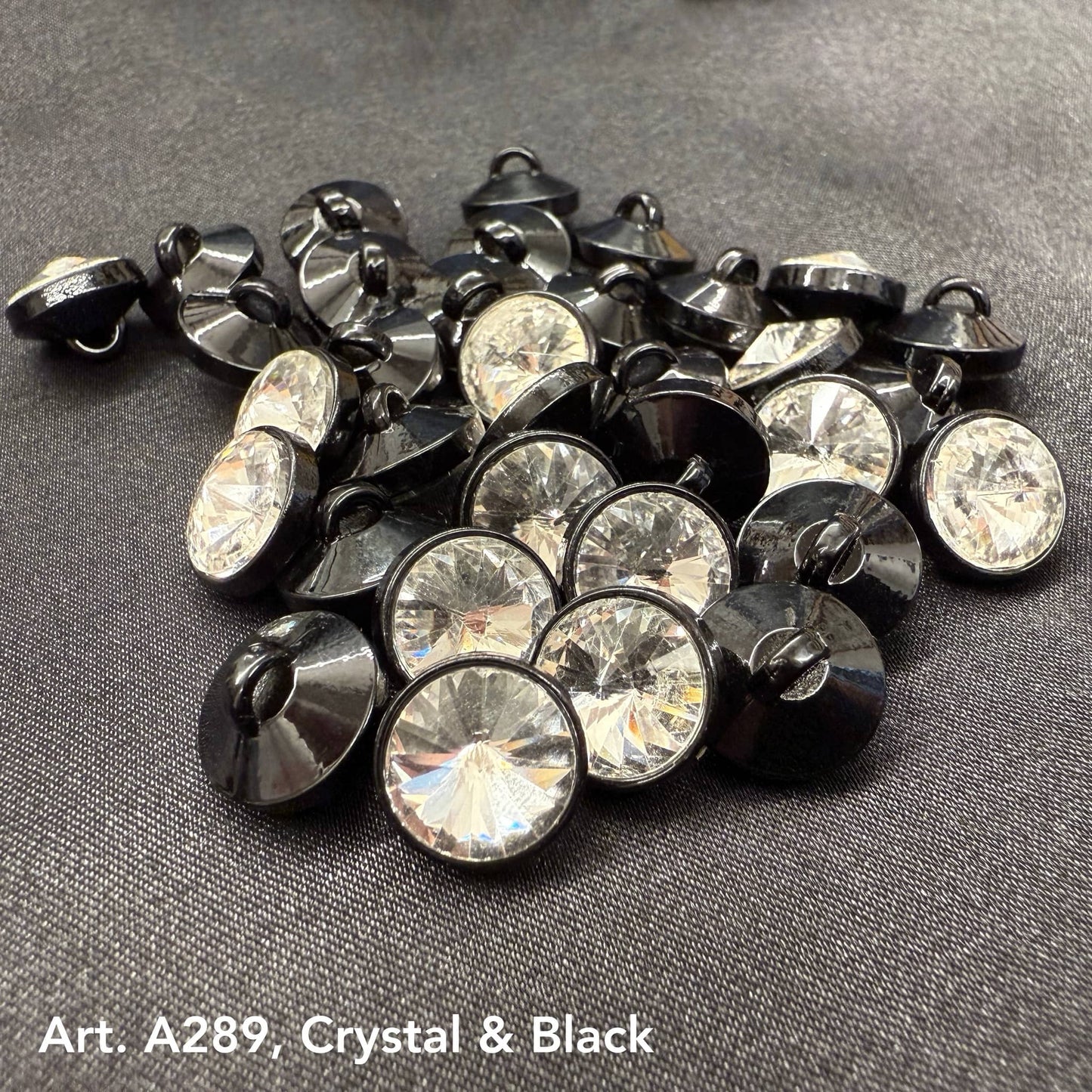 Assorted premium rhinestone buttons for dresses in crystal and black finish by Buttonology Inc