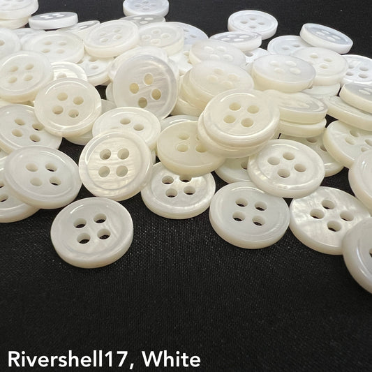 Rivershell buttons for clothing by Buttonology Inc in white with four-hole design on black background