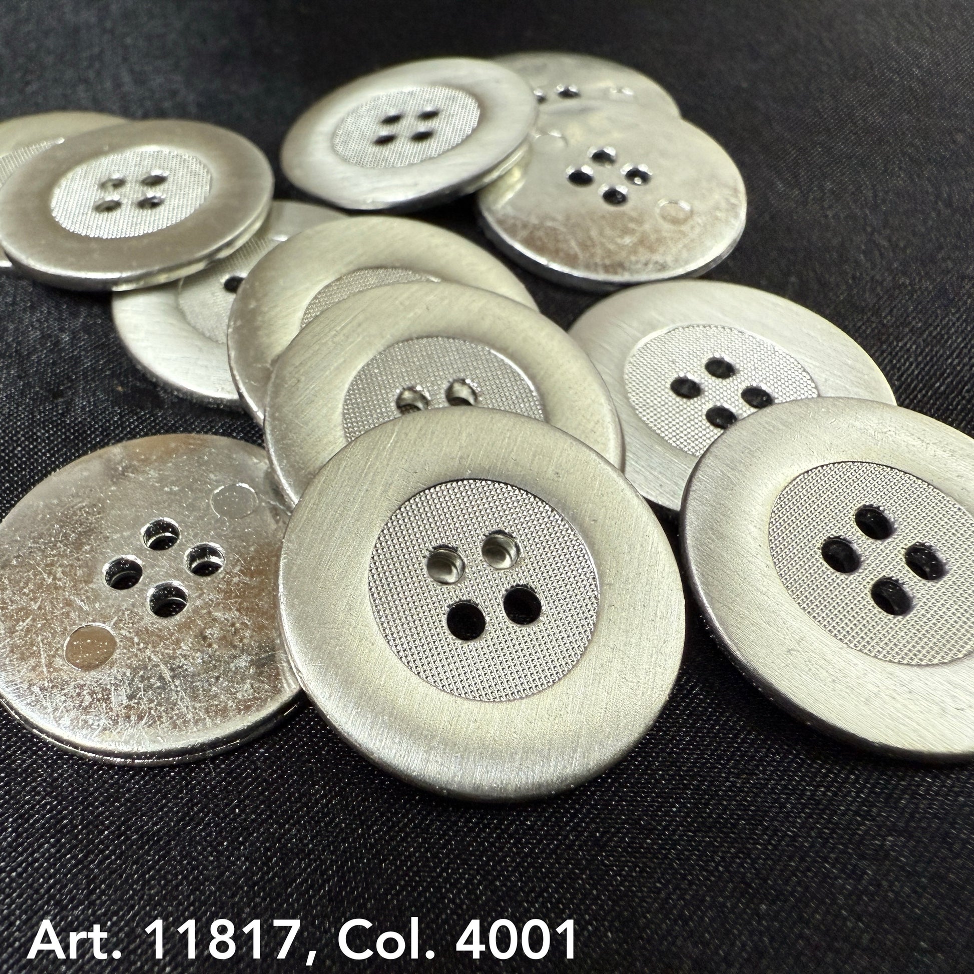 Rustic metal buttons for jackets with a textured center and four holes, from Buttonology Inc