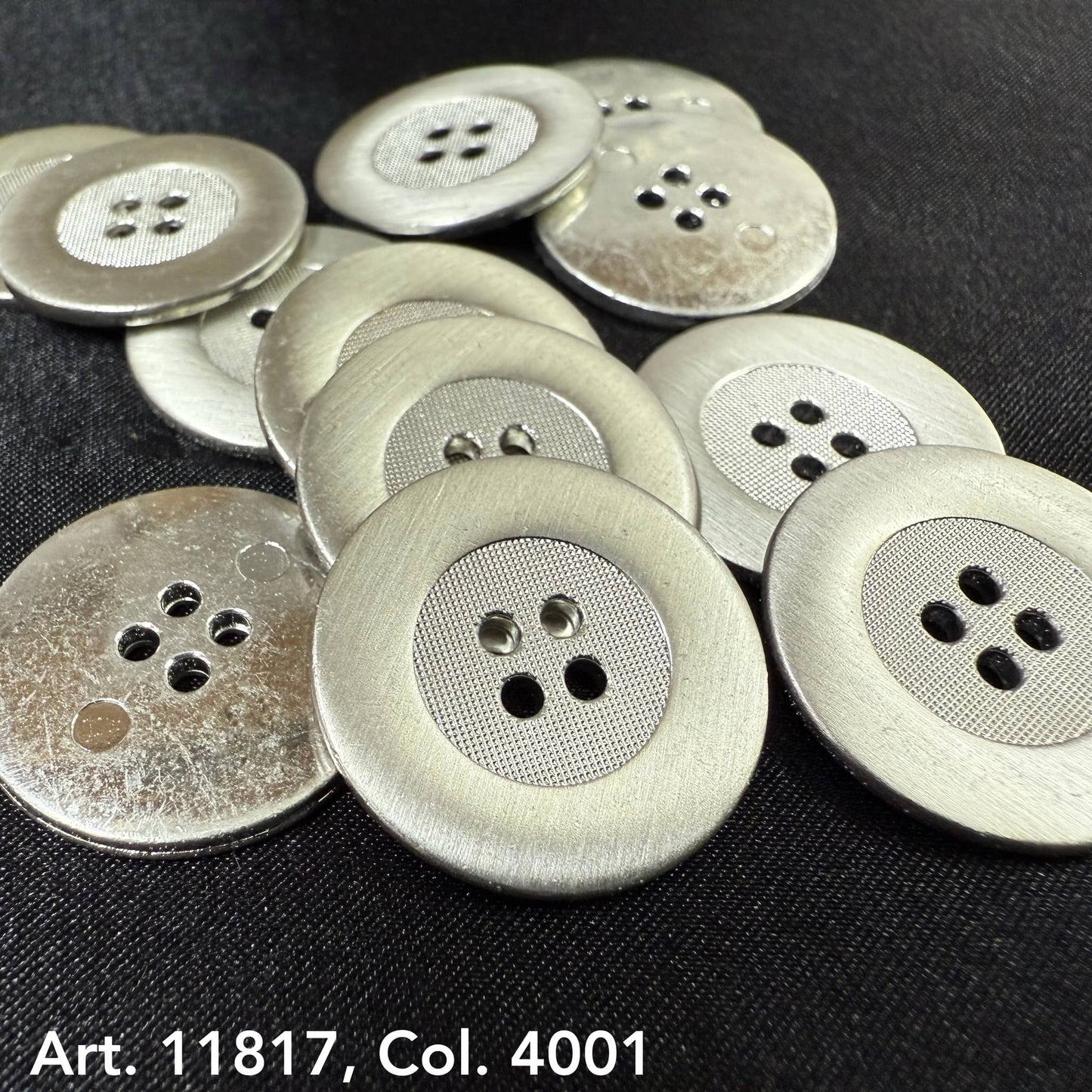Rustic metal buttons for jackets with a textured center and four holes, from Buttonology Inc