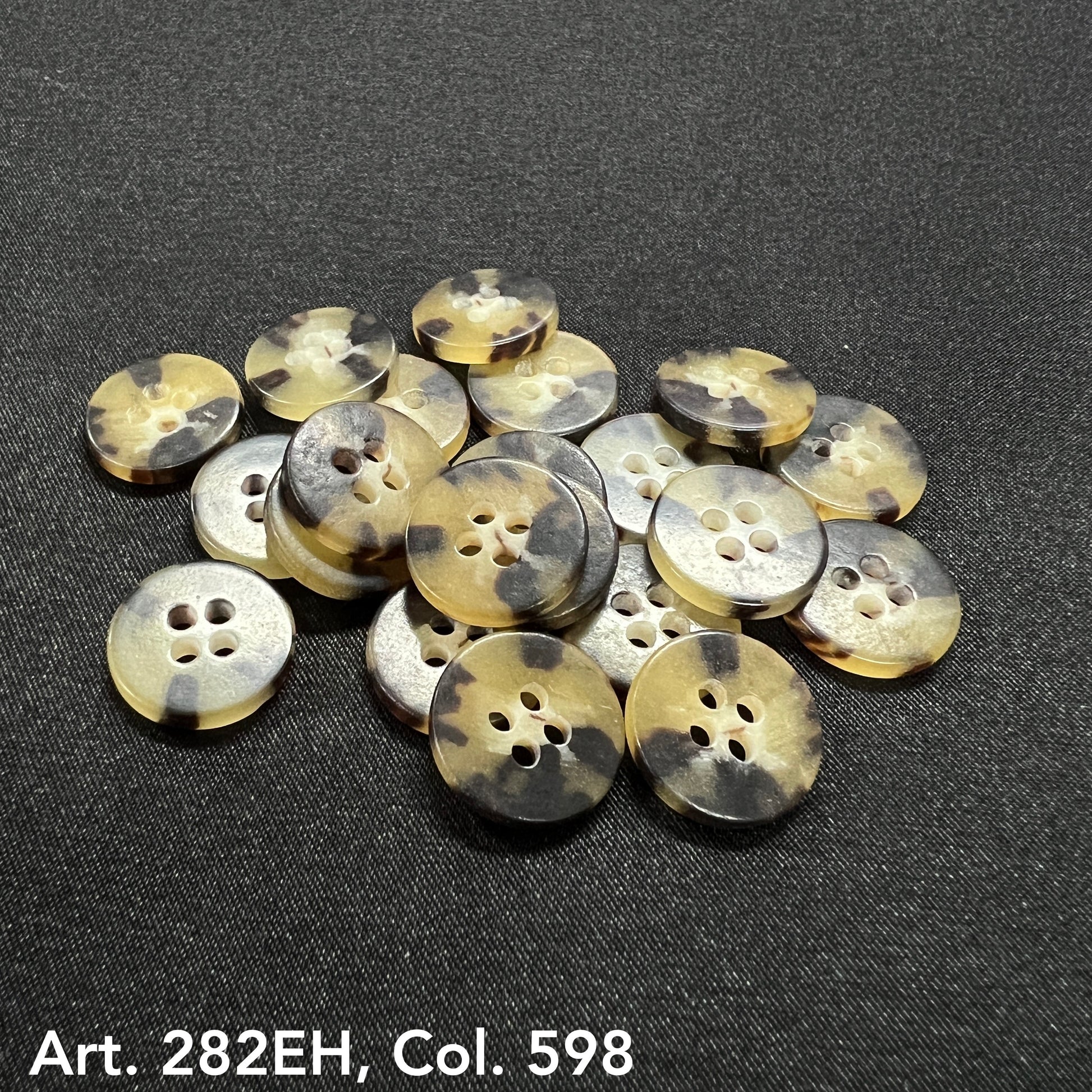 Round tortoiseshell style shirt size buttons with four holes from Buttonology Inc on black fabric