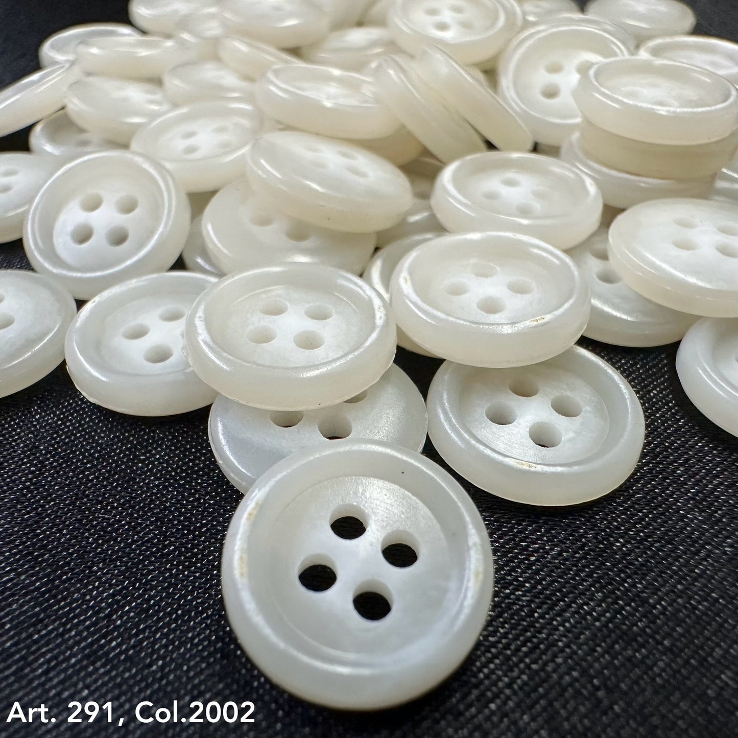 Assortment of Buttonology Inc. white shirting buttons 18L 20L with four holes for sewing projects