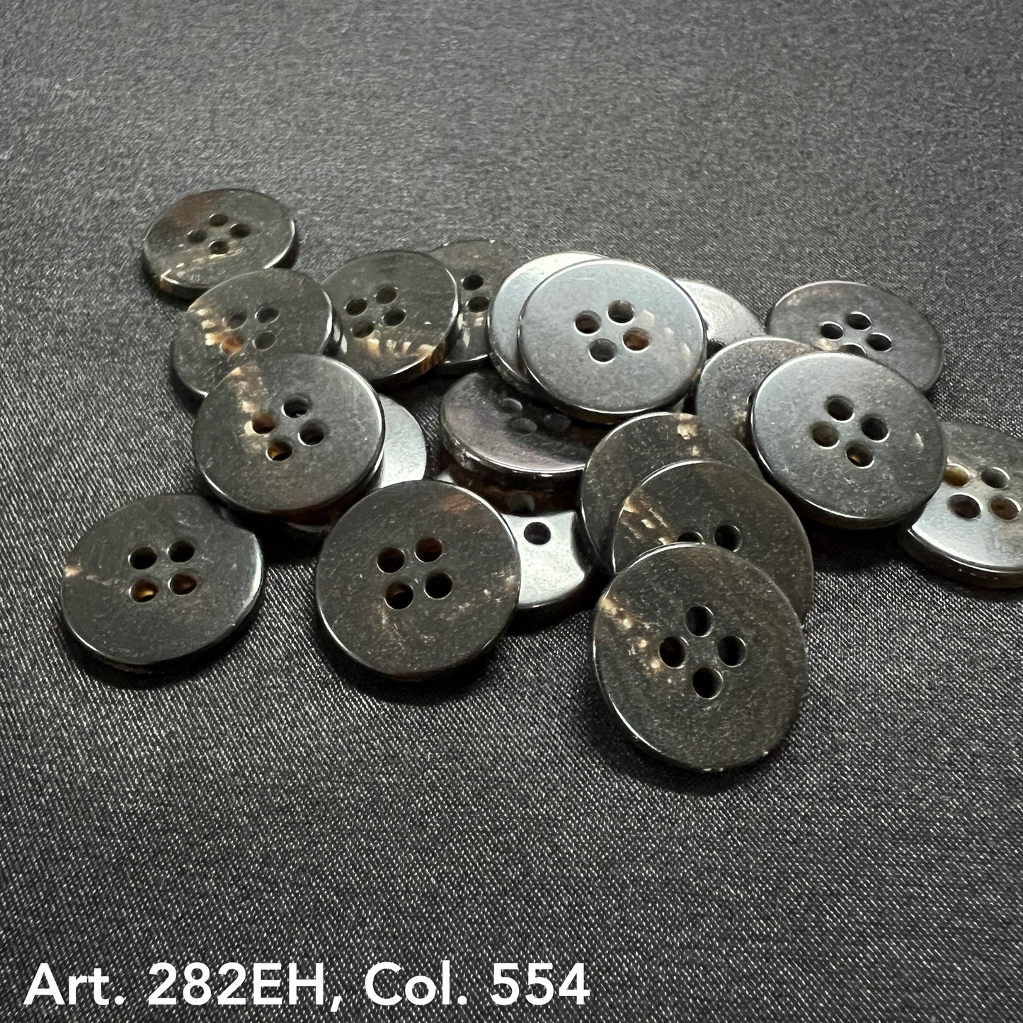 Assorted suit and coat buttons in dark shades, perfect for tailoring and garment repairs