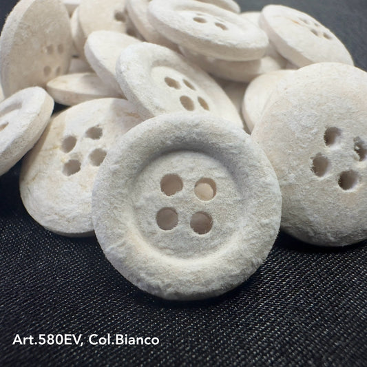 Eco-friendly velvet buttons by Buttonology Inc in white color with four holes for sewing