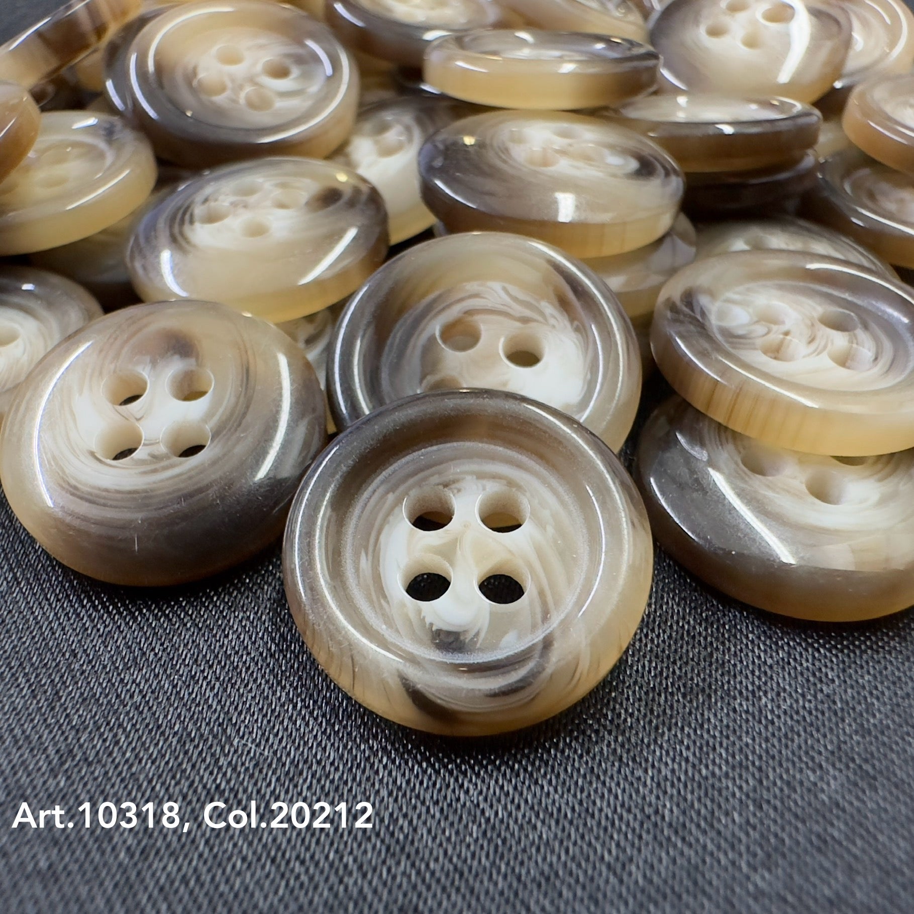 Close-up of high-quality shirt buttons in brown and beige tones from Buttonology Inc