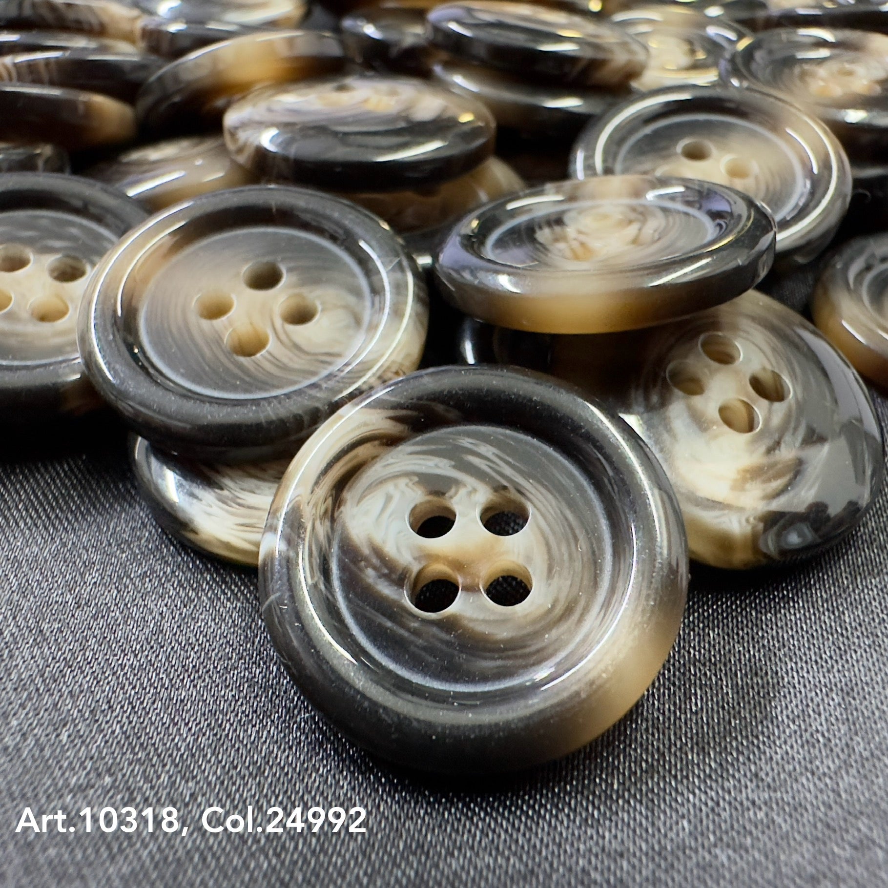 High-quality shirt buttons with a marbled black, beige, and brown design by Buttonology Inc
