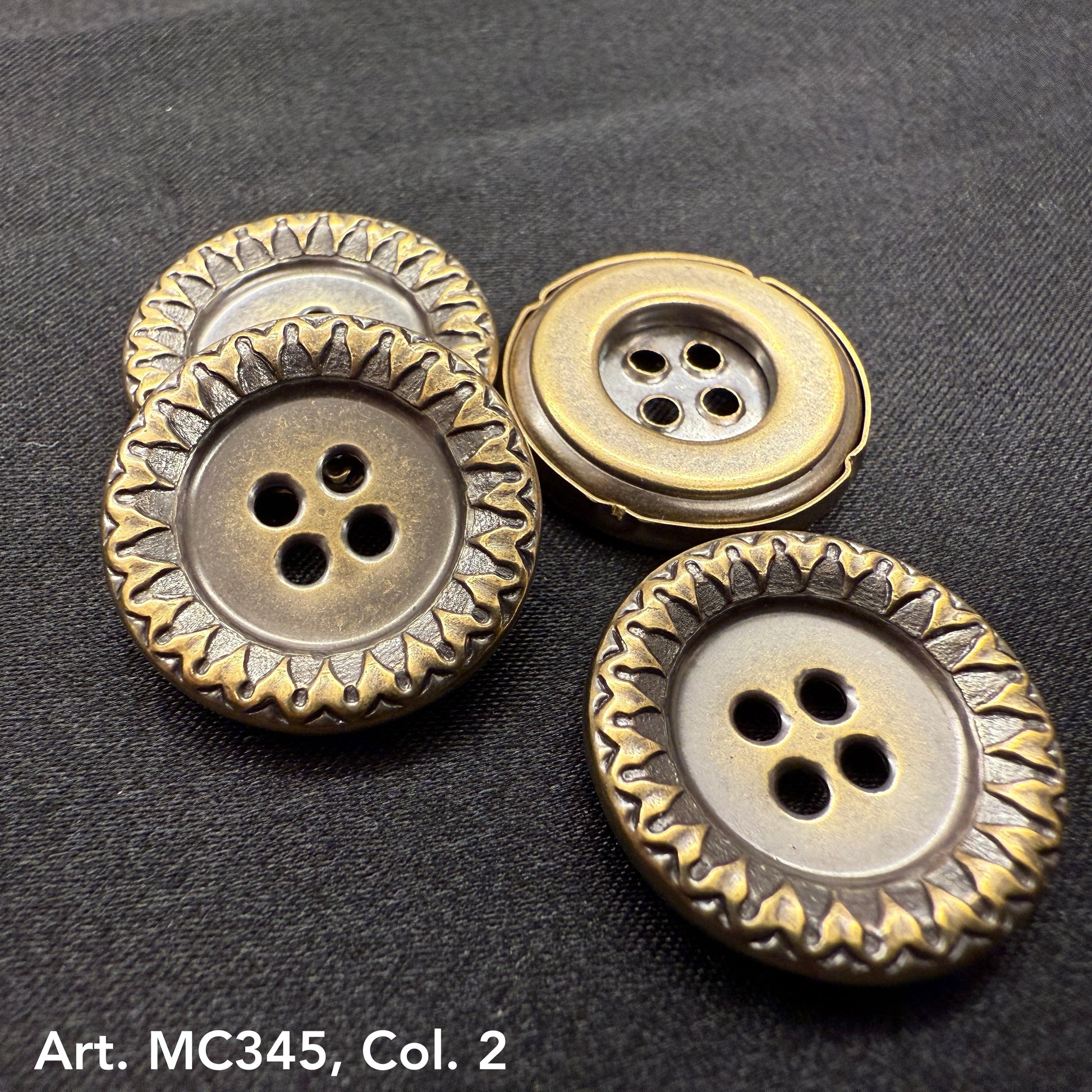 Buttonology Inc antique brass garment buttons four hole with decorative scalloped rim on black fabric